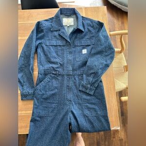 Blue utility jumpsuit. Long sleeve. Sips up the front. Size is M/L.